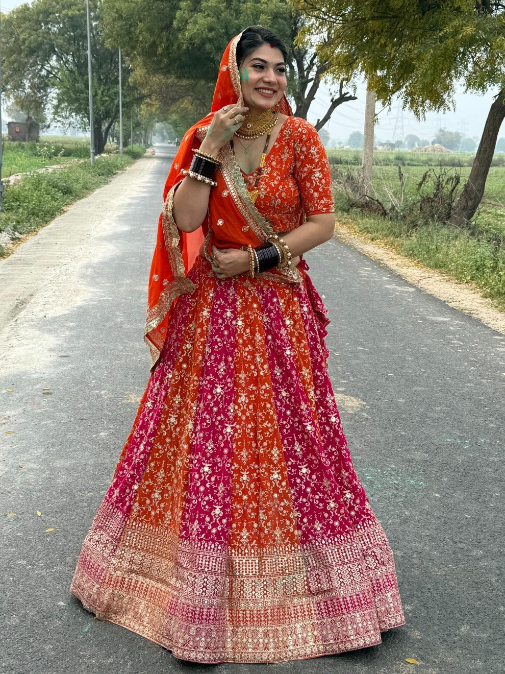 Vibrant Orange Pink Rajputi Lehenga | Radhika Boutique
